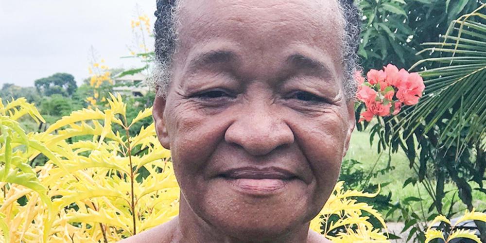 Sadie McKenzie, 63, outside her farmhouse in the Central American country of Belize. (Andrew McChesney / Adventist Mission)
