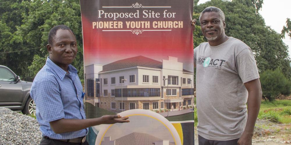 Pastors Goa Adeniran and Oyewole Oyerinde show the proposed site for the multipurpose center at Babcock University in Nigeria. Your support of the 13th Sabbath Offering will help make this resource possible!