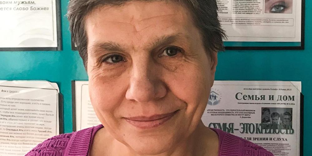 Tatyana Pashinko, 60, pictured by a bulletin board in the Southern Seventh-day Adventist Church, says, “I never made a mistake in all my years of work, and I only got into trouble because I wanted to obey God.” (Andrew McChesney / Adventist Mission)