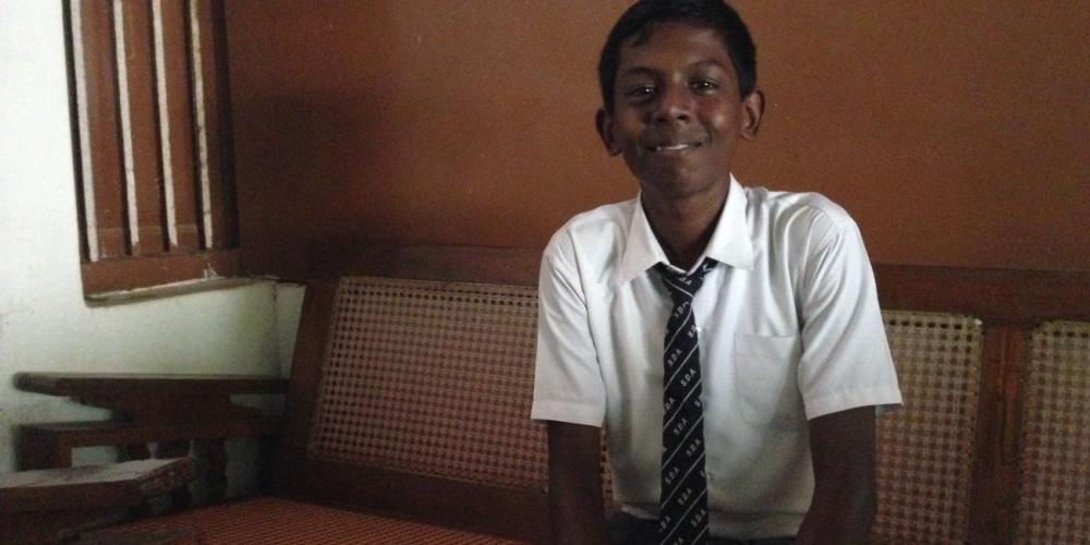Sundar Sivasubramanian, pictured at James Memorial Higher Secondary School in India, looks younger than 16, and his bashful smile hides the reality that he’s experienced more sorrow than many his age. He is in the ninth grade. (Andrew McChesney / Adventist Mission)