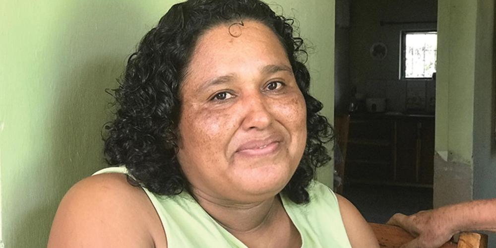 Olga Chee, 39, reflecting on her married life in her home in Orange Walk, Belize. (Andrew McChesney / Adventist Mission)